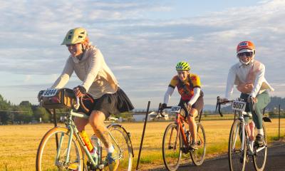Three women ride together on STP 2025